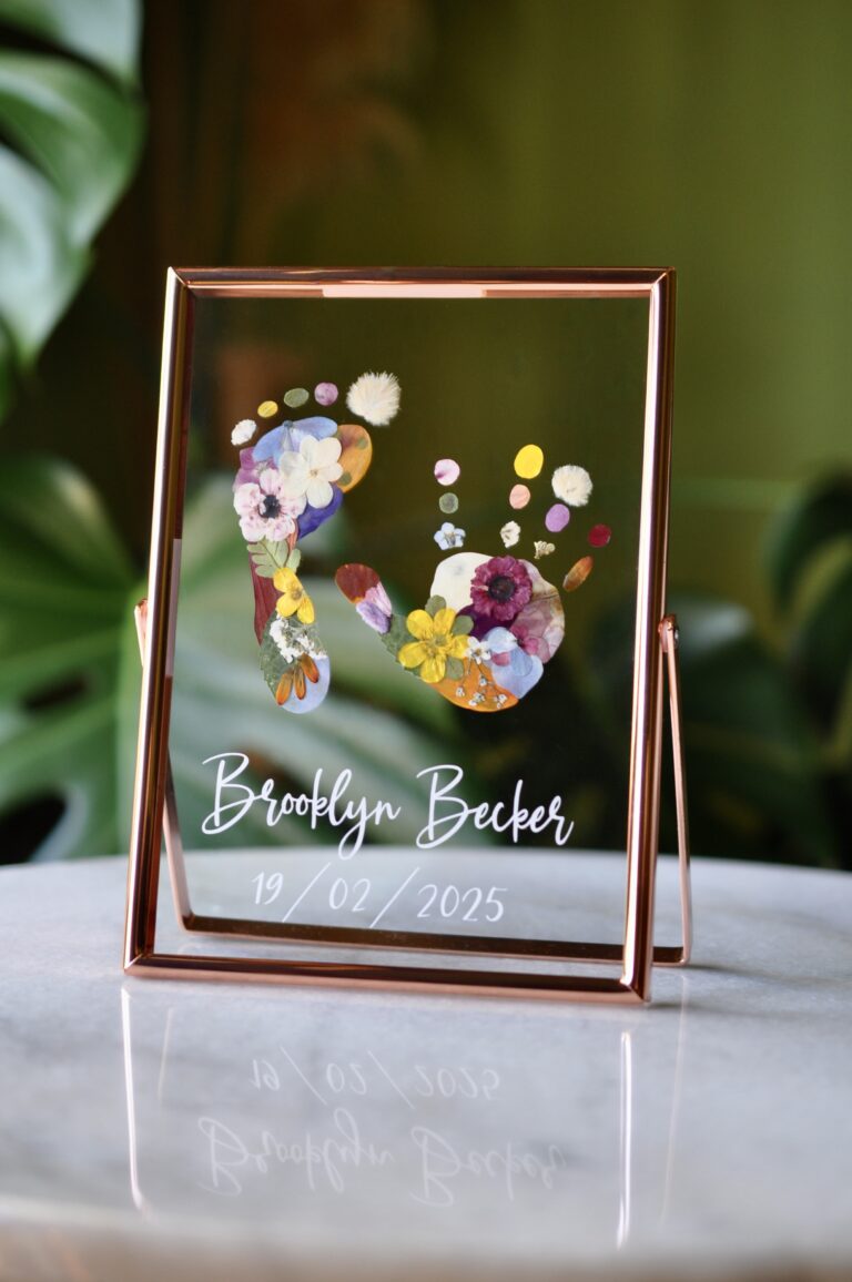 Custom baby hand and footprint keepsake with real pressed flowers in a rose golden frame – personalised newborn gift idea.