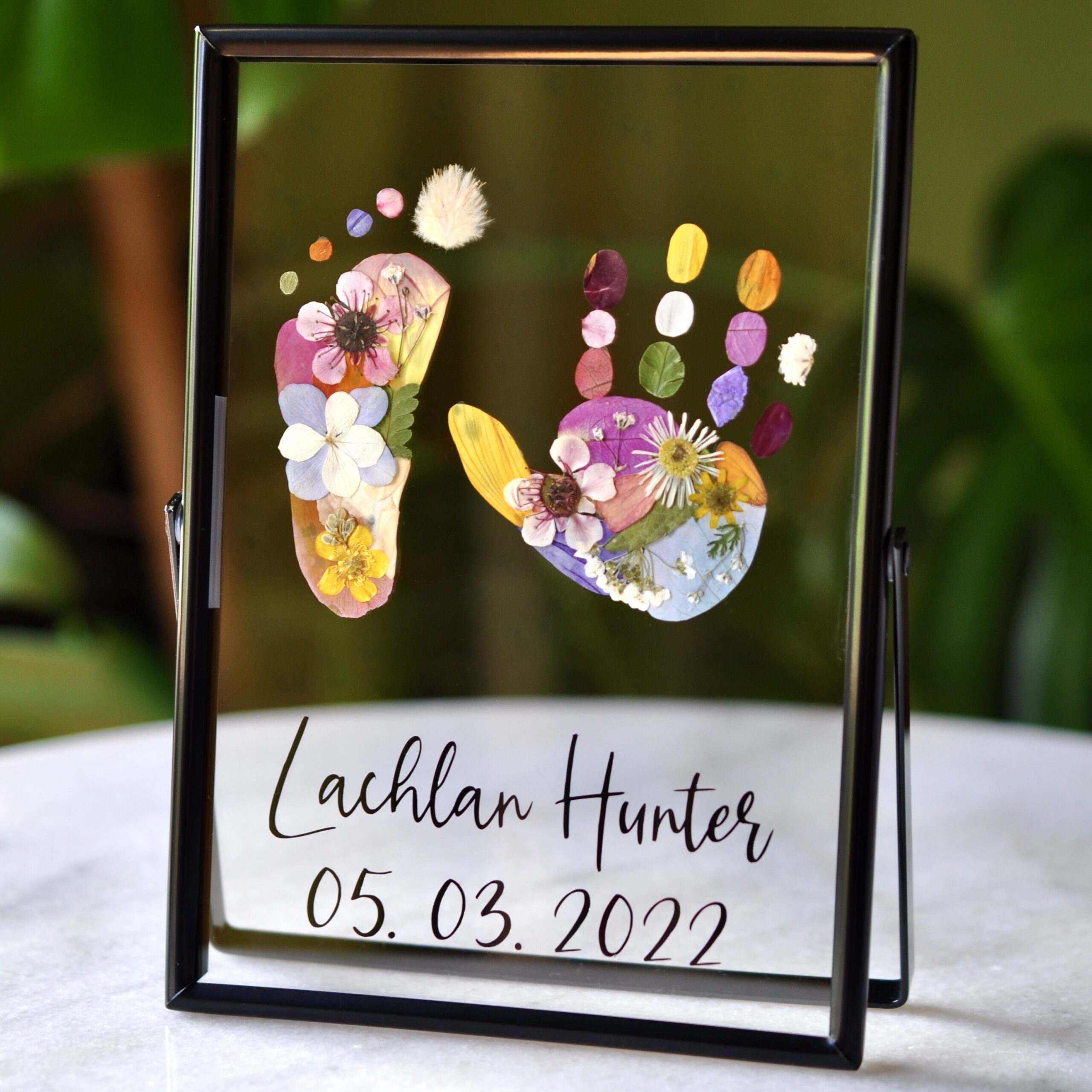 Preschooler Keepsake out of pressed flowers in black frame