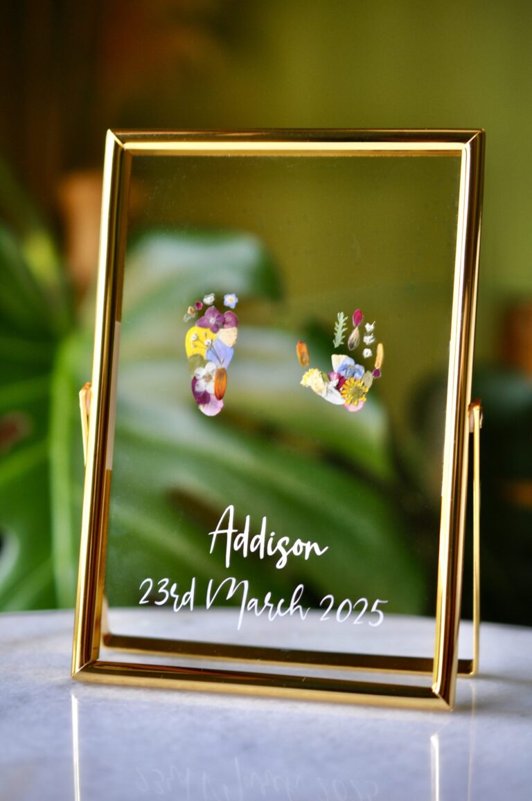 Hand & Footprint out of pressed flowers in golden frame with name