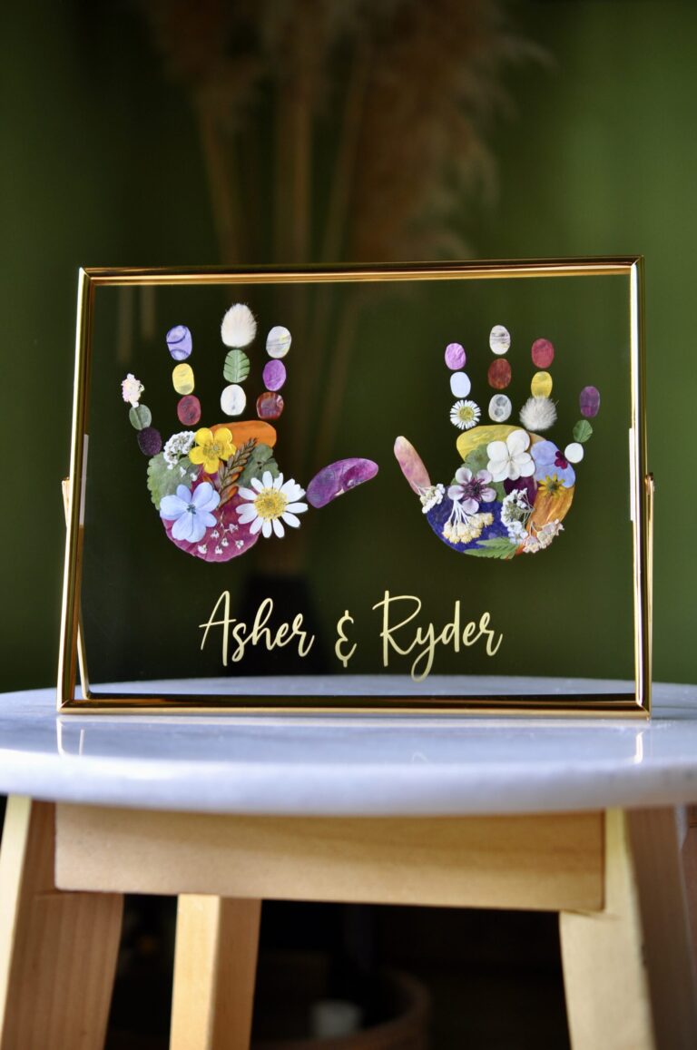 Floral Sibling Handprint artwork out of pressed flowers