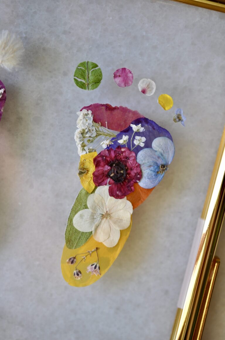 Close up of baby foot made out of pressed flowers