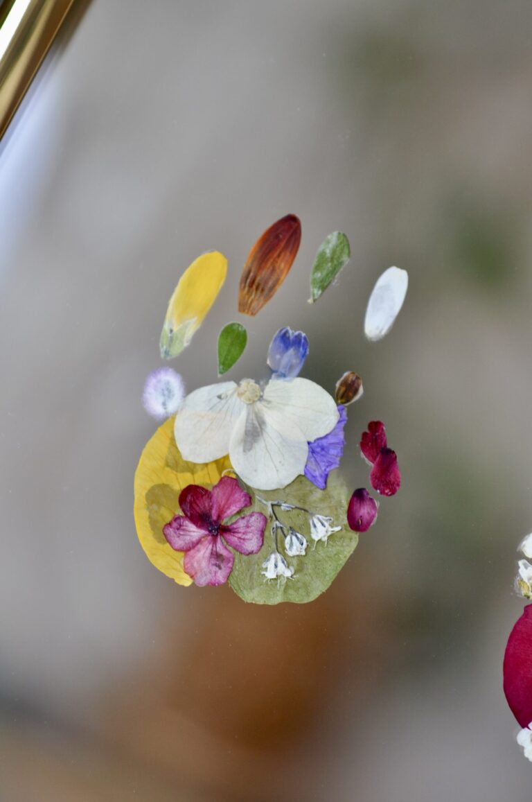 Close-Up of angel baby handprint out of flowers