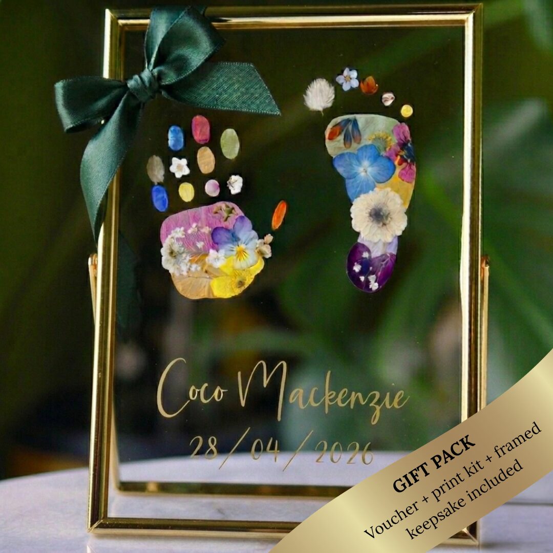 Personalised floral baby footprint keepsake in a gold floating frame with and elegant gift ribbon, perfect as a baby shower or newborn gift.