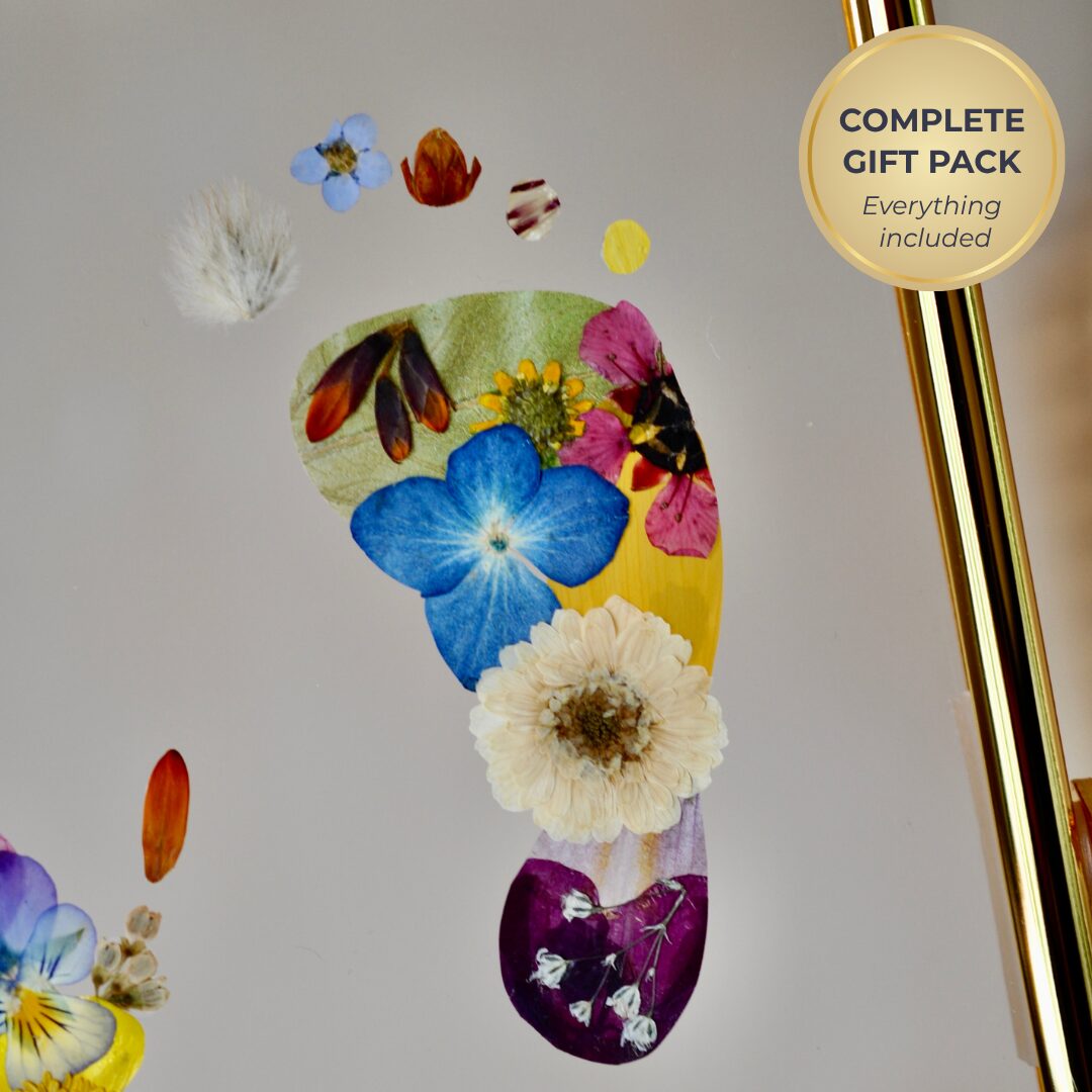 Elegant baby keepsake gift pack with personalised floral footprints in a gold floating frame, ideal for baby showers, Mother’s Day and newborn gifting