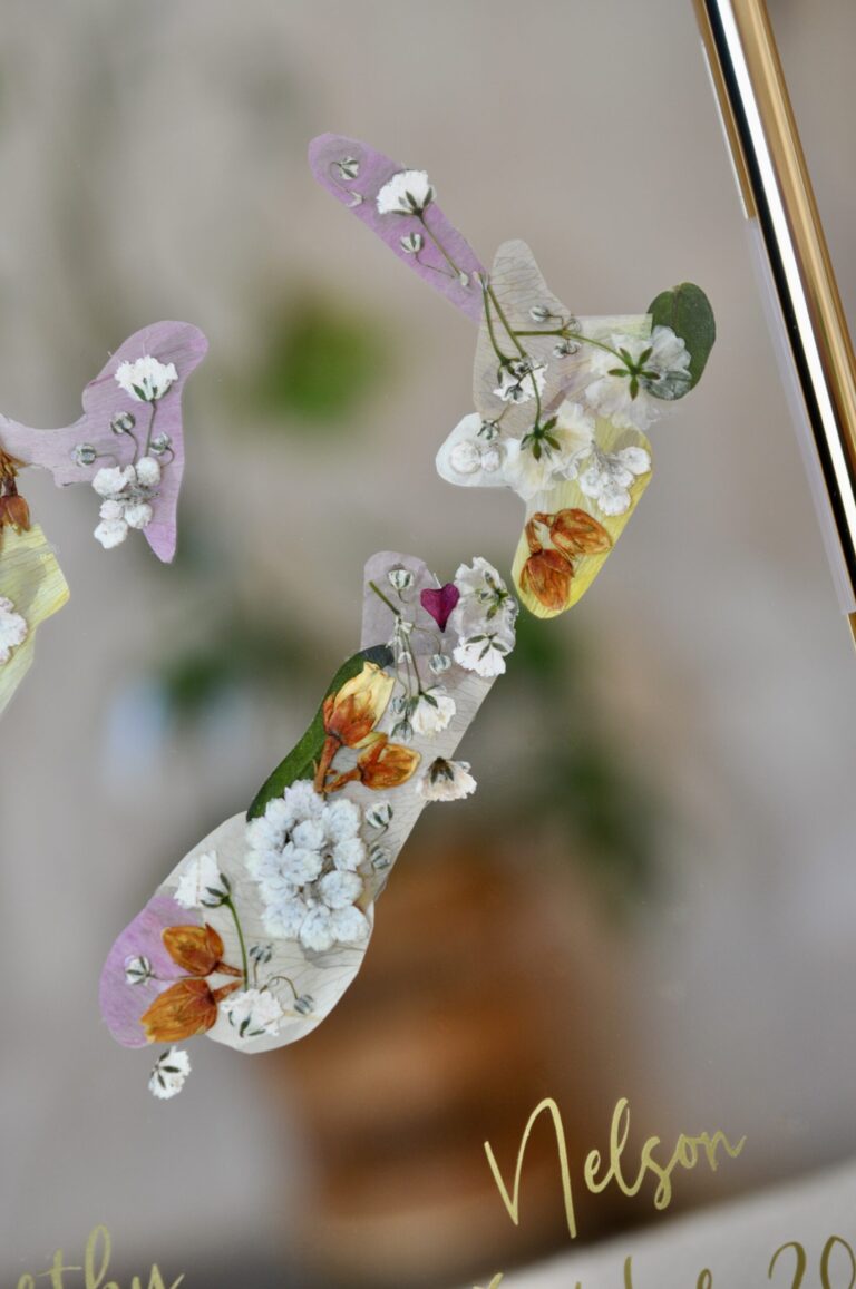New Zealand map made out of pressed flowers