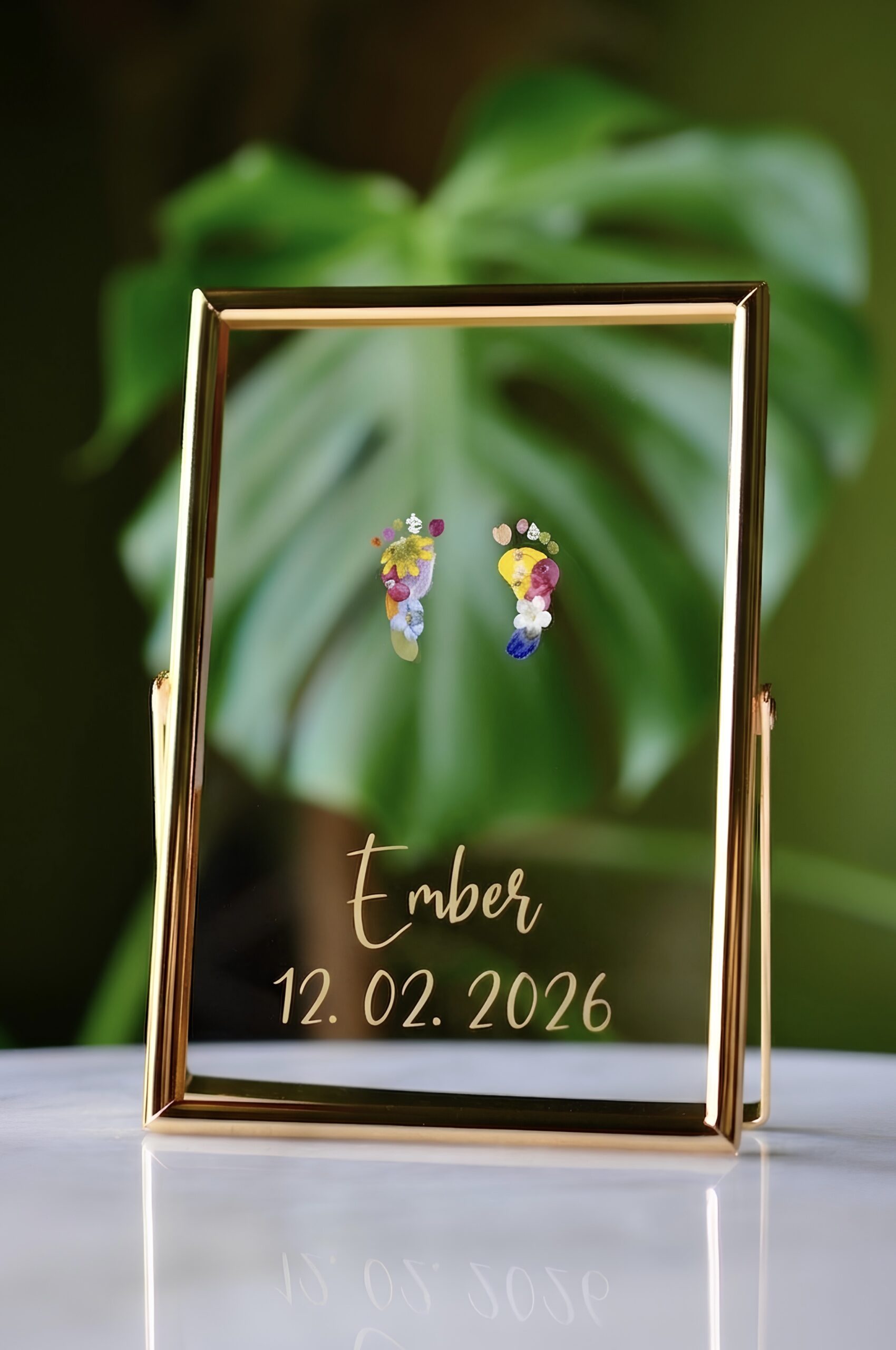 Baby Footprints out of pressed flowers in golden floating frame with Name